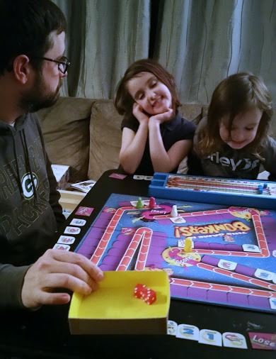 Brian playing Bonkers board game with the kids.