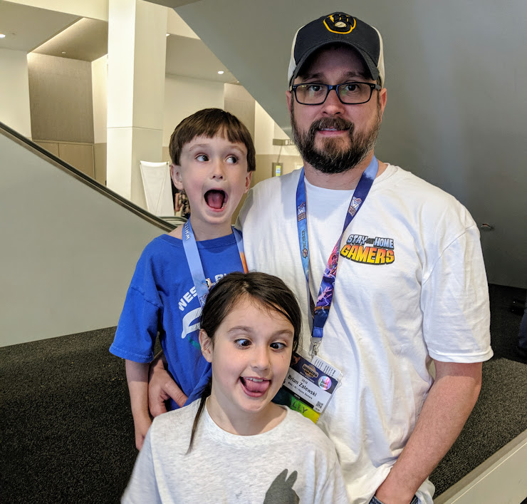 Brian and the kids making silly faces at Origins Game Fair 2019